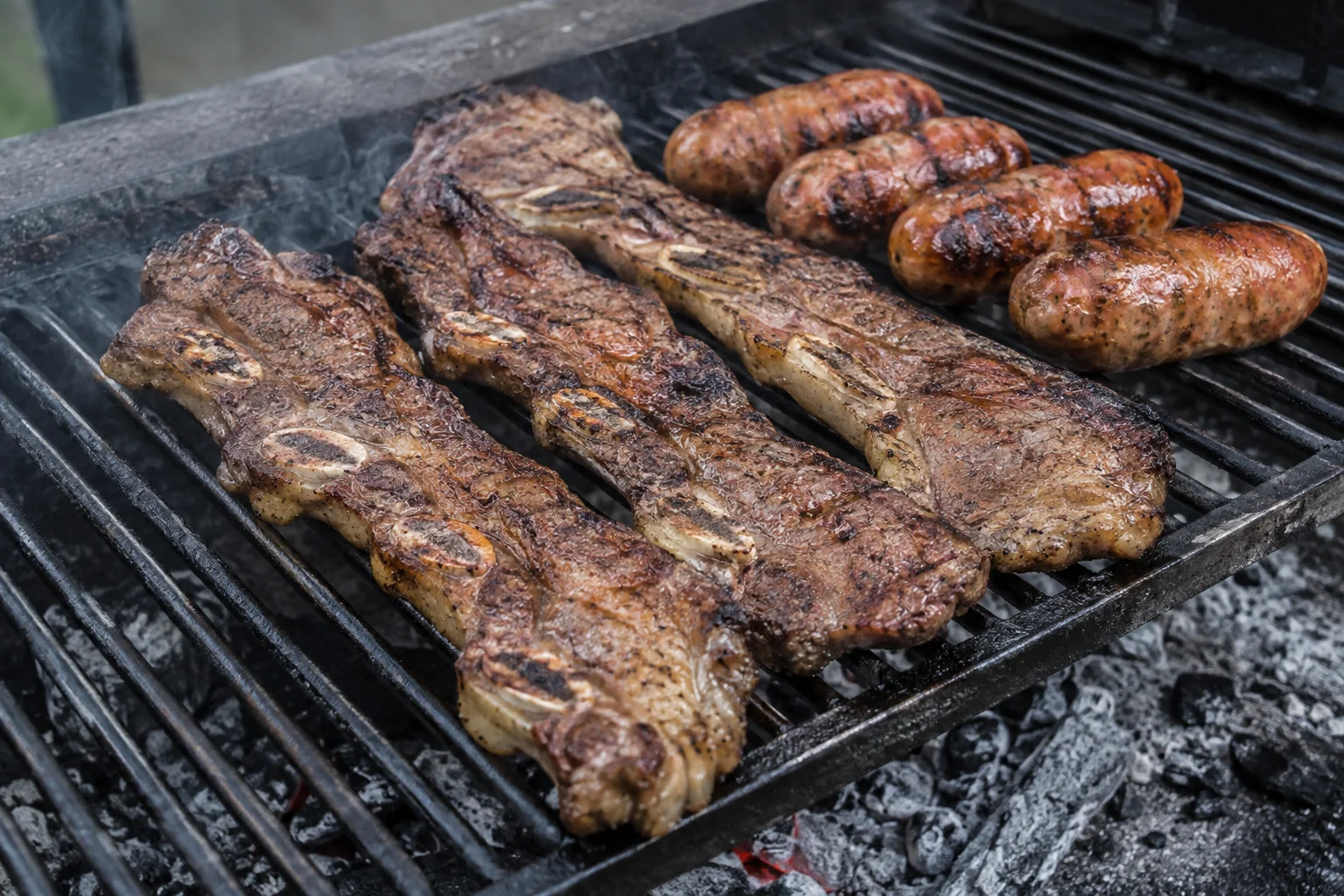 Traditional Argentine asado on a live parrilla grill
