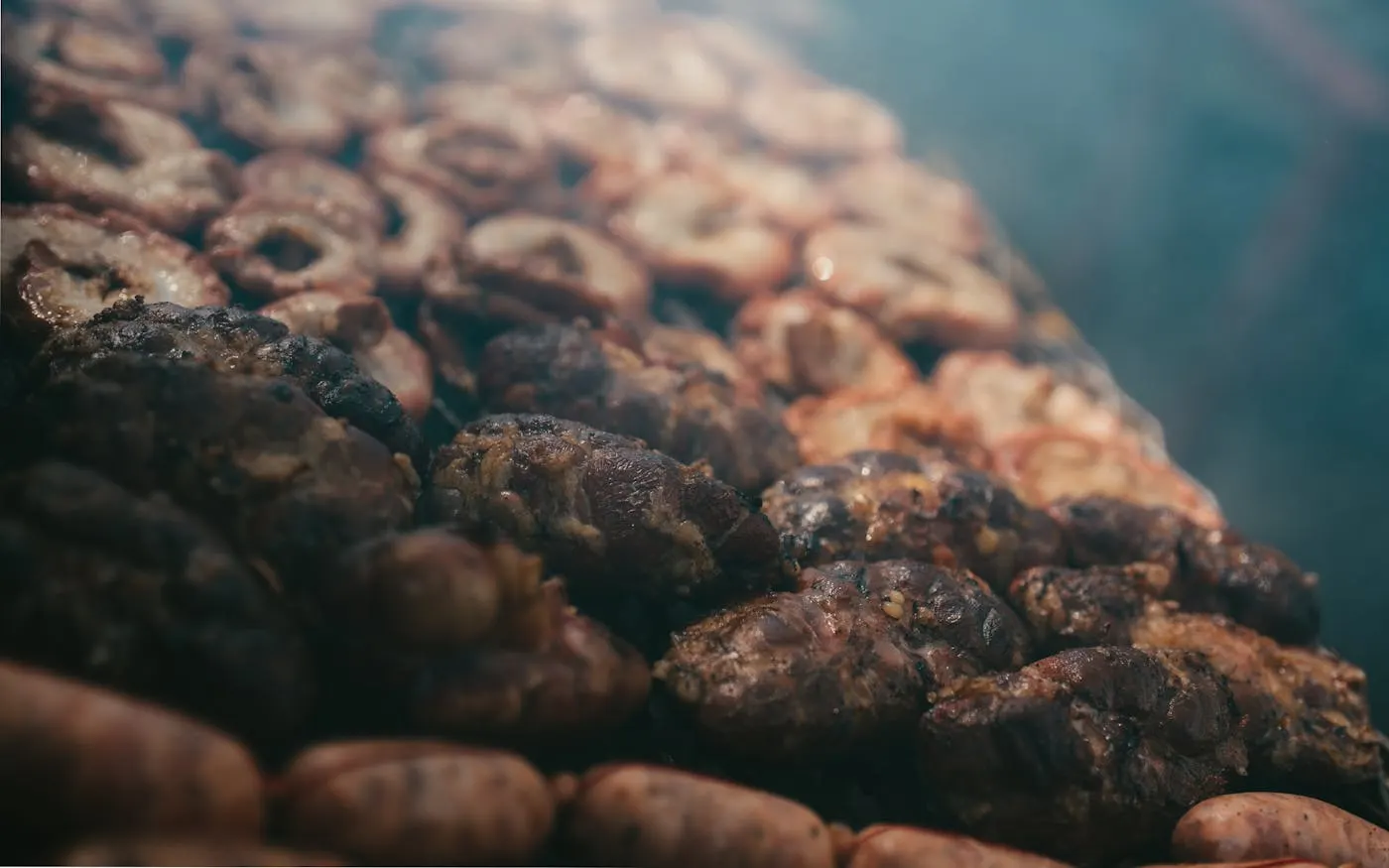 Traditional Argentine asado on a live parrilla grill